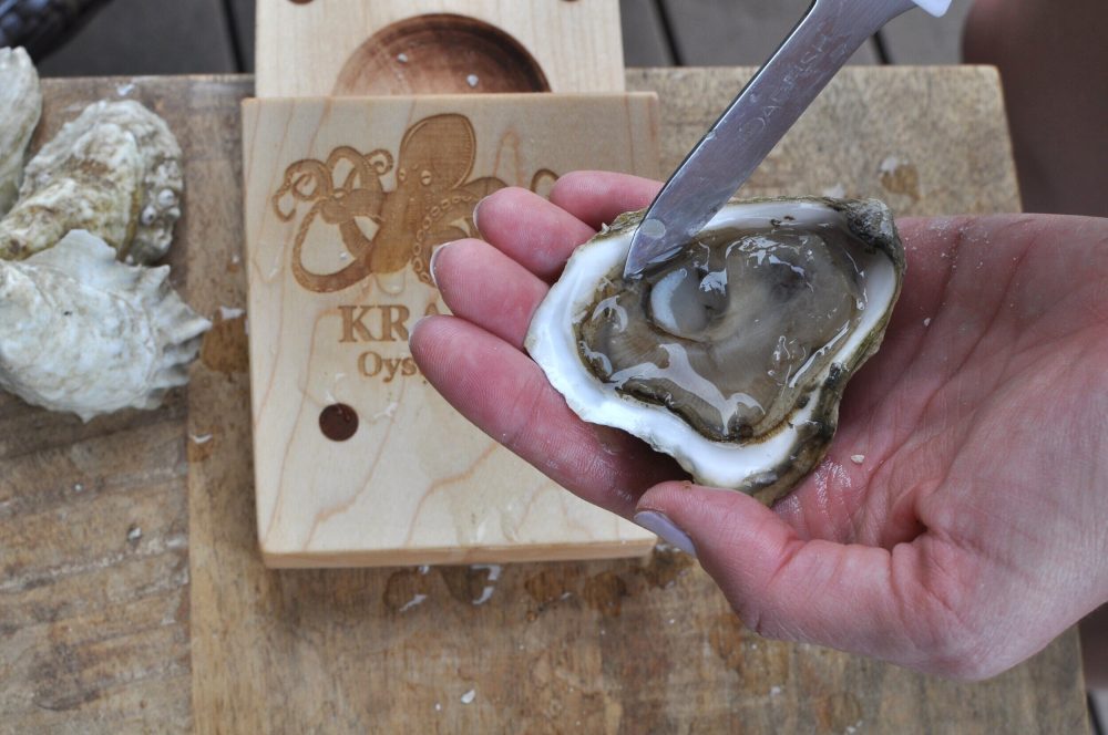 Shucking a perfect oyster at home.
